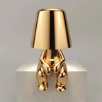 Goldene Tischlampe – Kreatives Figurendesign | Dekorative Wohnraumleuchte